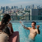 Asian couple on holiday taking a selfie together by the poolside
1495759684
Happy Asian couple on holiday having a splashing good time by the poolside - stock photo
Asian couple on holiday taking a selfie together by the poolside