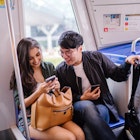 A young diverse interracial Asian couple are smiling as they sit in a train and look a a smartphone together. A Korean man and his Indian companion are smiling as they take public transportation.; Shutterstock ID 1368668465; full: Singapore getting around; gl: 65050; netsuite: Online ed; your: Claire Naylor
1368668465